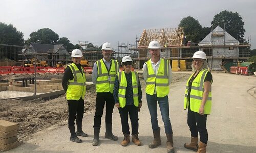 Group of people at a construction site.