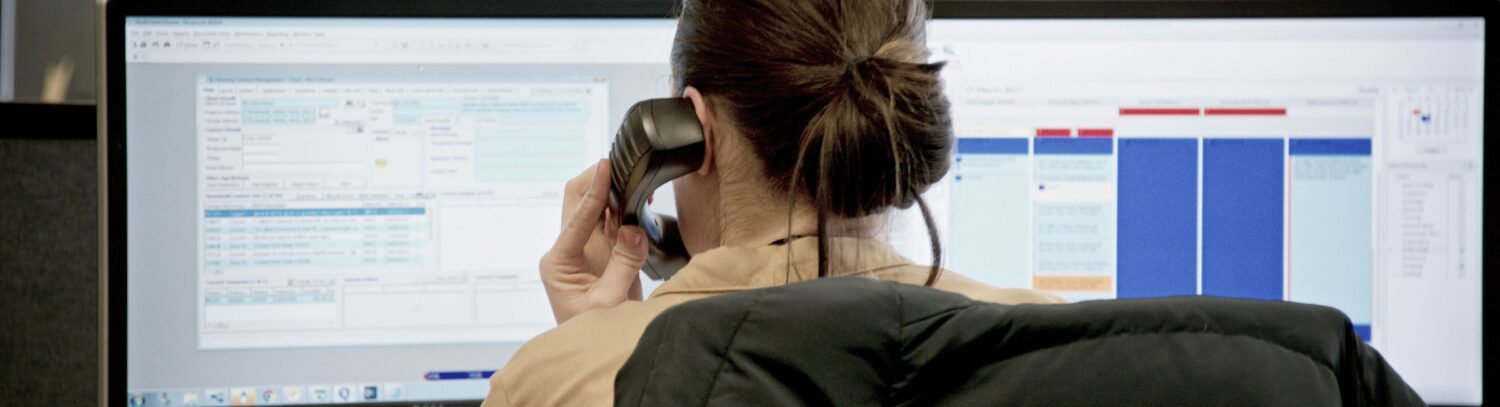 A settle colleague talking on the phone