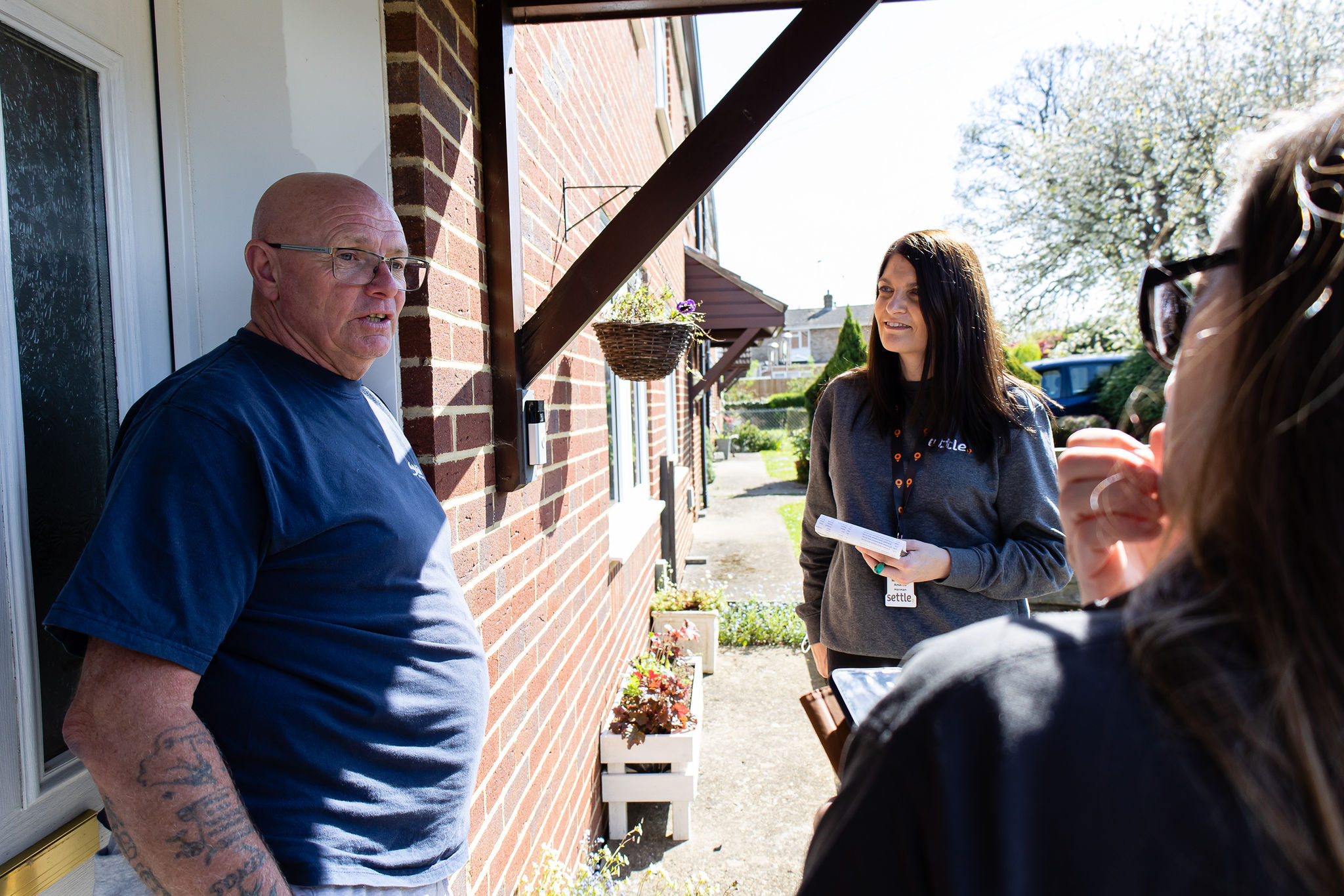 People talking to residents on the Big door knock. 