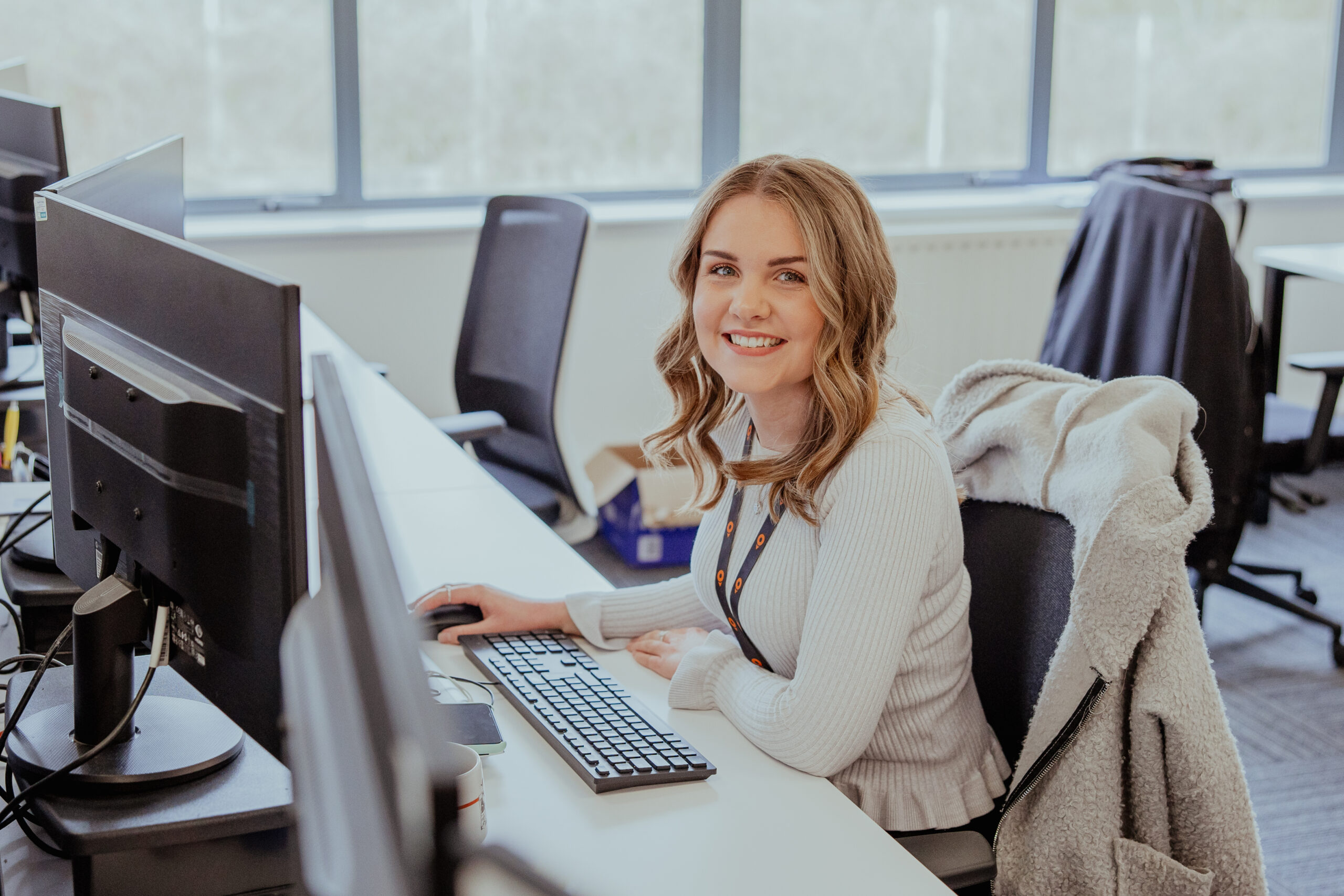 Settle colleague at her desk.