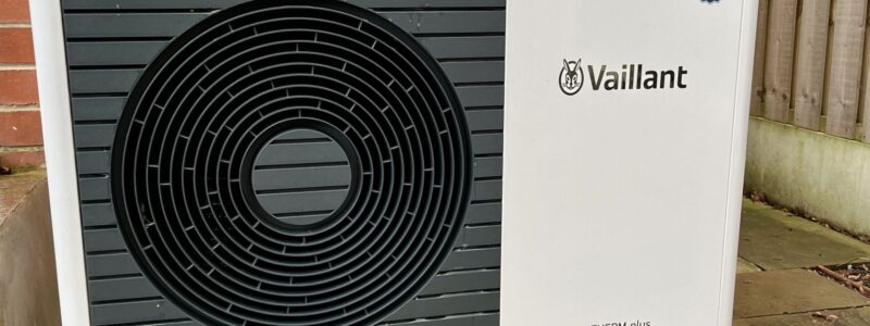 An air source heat pump unit outside a house. 