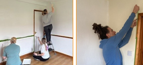 Settle and Lovell colleagues repainting a room using rollers and brushes to apply white paint to the walls.