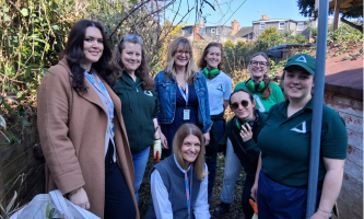 Settle colleagues with Groundwork East volunteers starting work in a residents' garden.