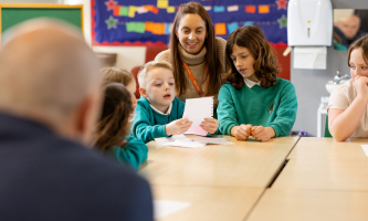 Ollie, Pupil Parliament class rep reads his speech to the group of children and adults at the meeting. 