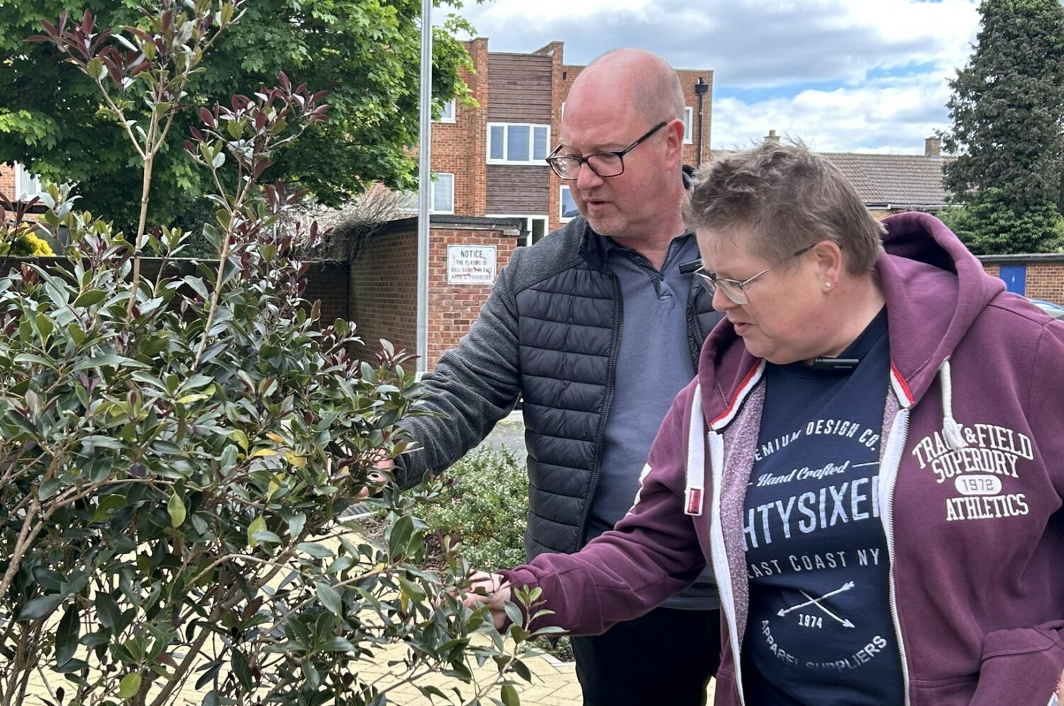 Steve and Heidi looking at one of the plants